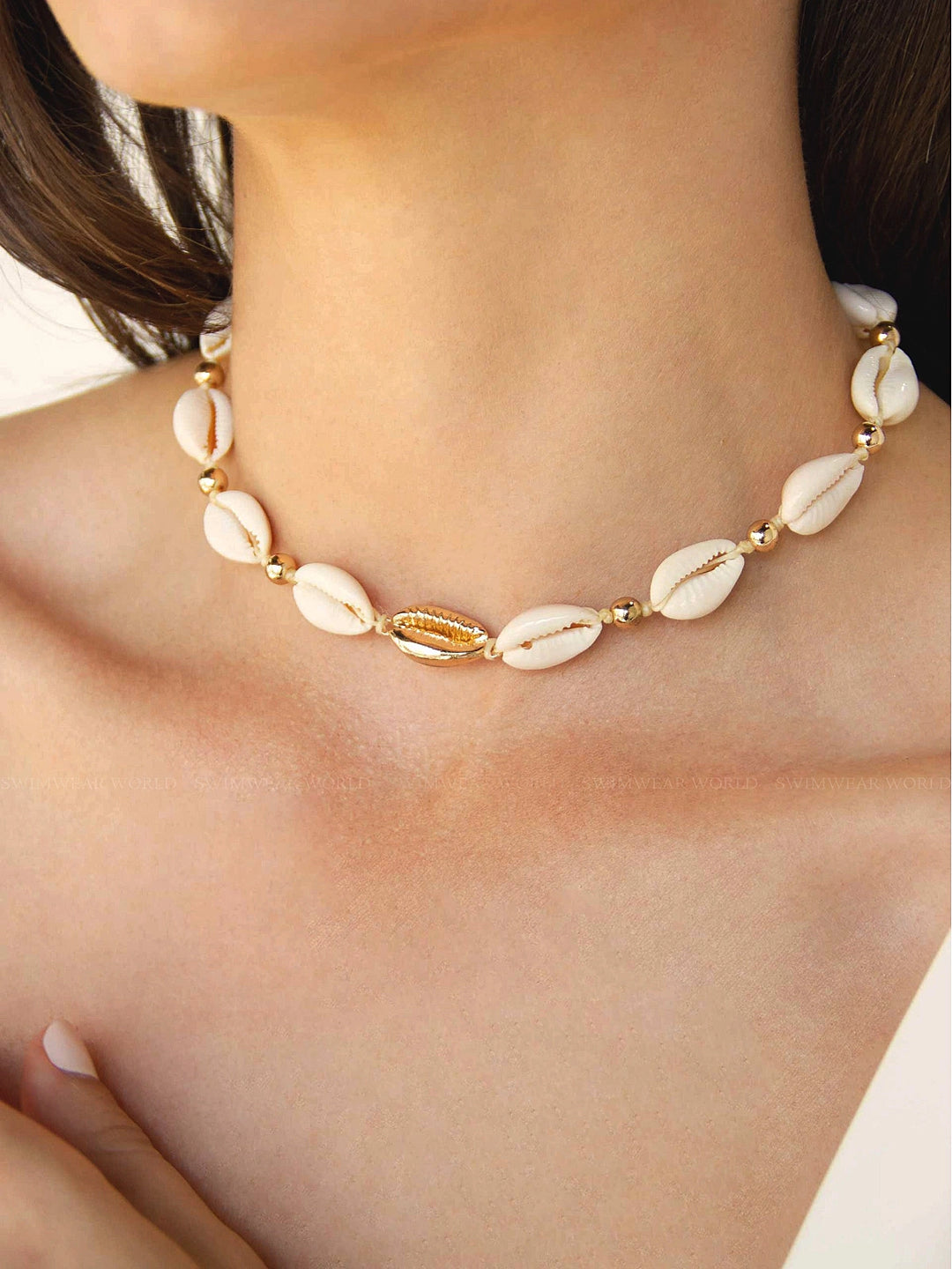Gold plated cowrie shell necklace clearance